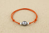Bracelet enfant orange avec perle de Tahiti