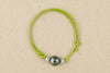 Bracelet enfant vert avec perle de Tahiti