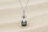 Pendentif en argent 925 avec le dos du tiki qui enlace une perle de Tahiti sur 