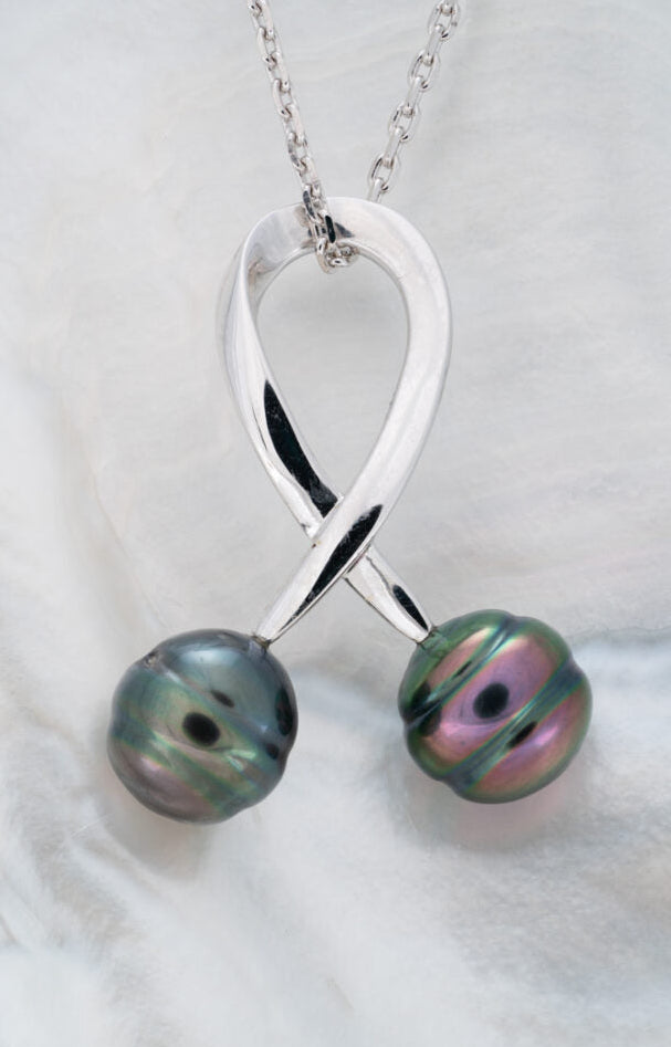 Pendentif en argent avec 2 perles de tahiti cerclées
