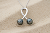 Pendentif en argent avec 2 perles de tahiti cerclées