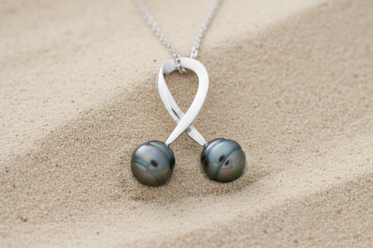Pendentif en argent avec 2 perles de tahiti cerclées